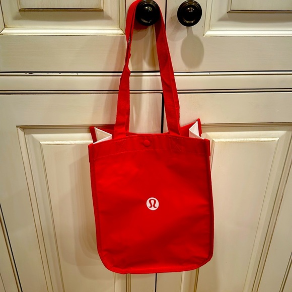 lululemon athletica Handbags - LULULEMON REUSABLE RED AND WHITE TOTE BAG WITH RED HANDLES AND RED SNAP CLOSURE